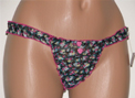 Frilly thong with pink hearts.